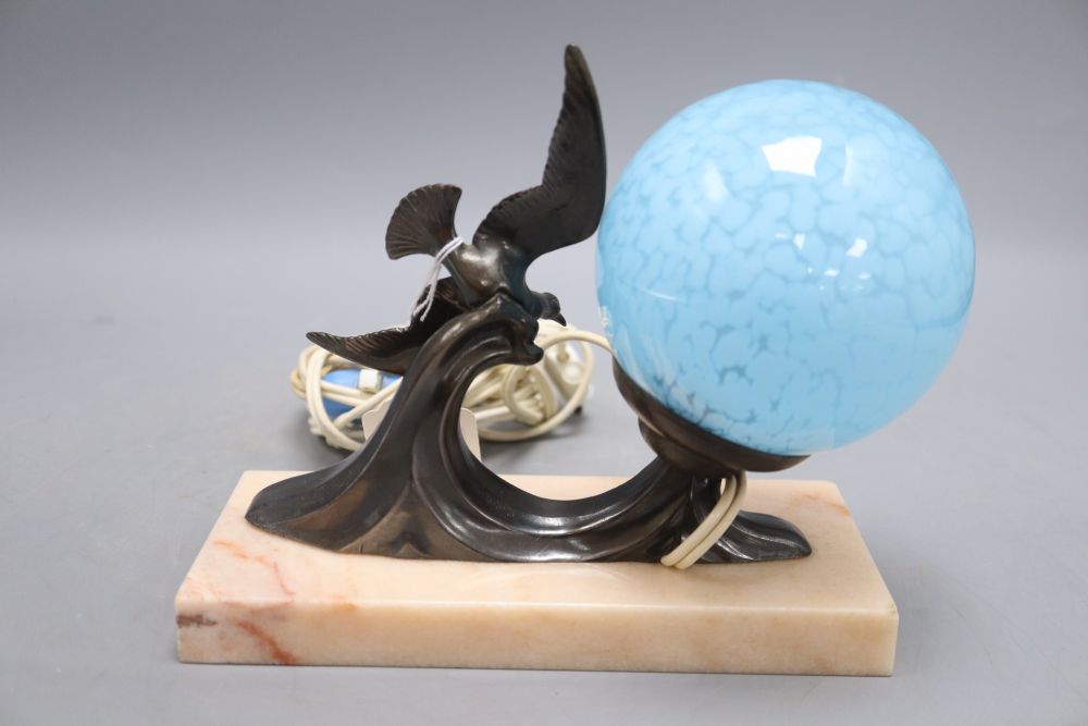 An Art Deco lamp of seagulls on marble stand and blue shade, height 17cm